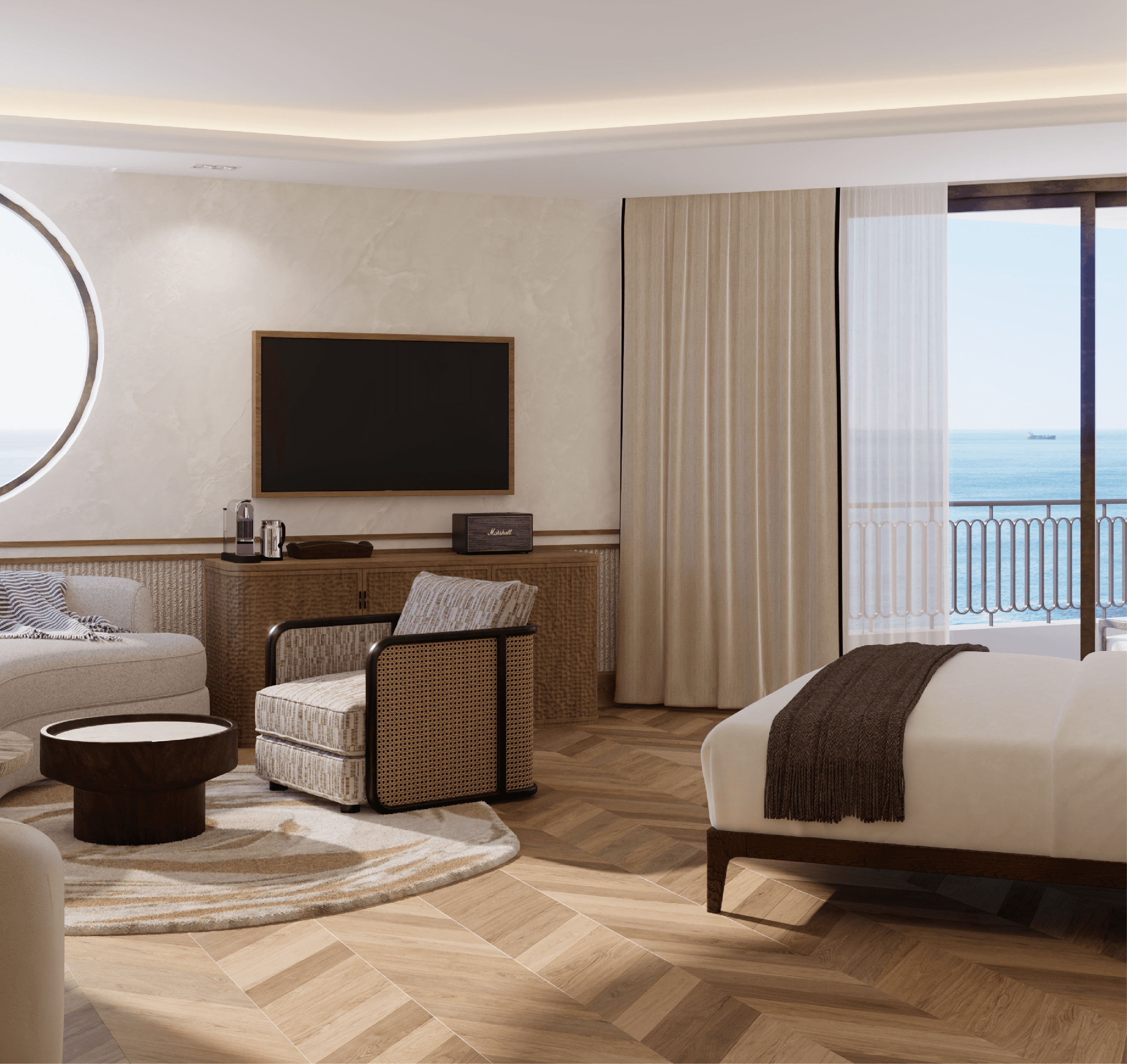 Sea-facing suite with edge of the oval window and bed in frame